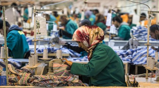 Employees of Still Nua's fashion work at a textiles factory in an industrial park connected to a free-trade zone in the Moroccan city of Tangiers on March 13, 2018. - Home only to grazing sheep just a decade or so ago, a stretch of Moroccan coastline near Tangiers is now abuzz as its new port presses full speed ahead towards expansion. (Photo by FADEL SENNA / AFP)