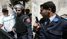Armed Moroccan police officers are seen near the American Language Center in Casablanca, Morocco, Saturday April 14, 2007 after an explosion. Two brothers strapped with explosives blew themselves up near the American Language Center in Casablanca on Saturday, and police arrested three people, including one wearing an explosives belt, an official and news reports said. (AP Photo)