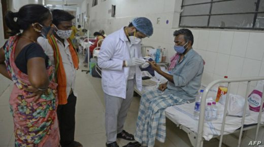 A doctor examines a patient who recovered from Covid-19 coronavirus and now infected with Black Fungus, a deadly fungal infection at a ward of a government hospital in Hyderabad on May 21, 2021. (Photo by NOAH SEELAM / AFP)