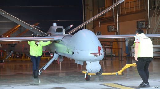 The Anka Drone, 8.6 metres long and with a wingspan of 17.6 metres, manufactured in Turkish Aerospace's huge, ultra-secure facilities in Ankara which cover 4 million square metres of hangars where 10,000 people, including 3,000 engineers are employed is moved by employees in Ankara on March 5, 2021. (Photo by Adem ALTAN / AFP)